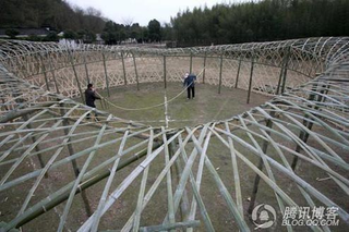 Illustration for article titled Chinese Farmers Build Birds Nest Stadium Out of Bamboo